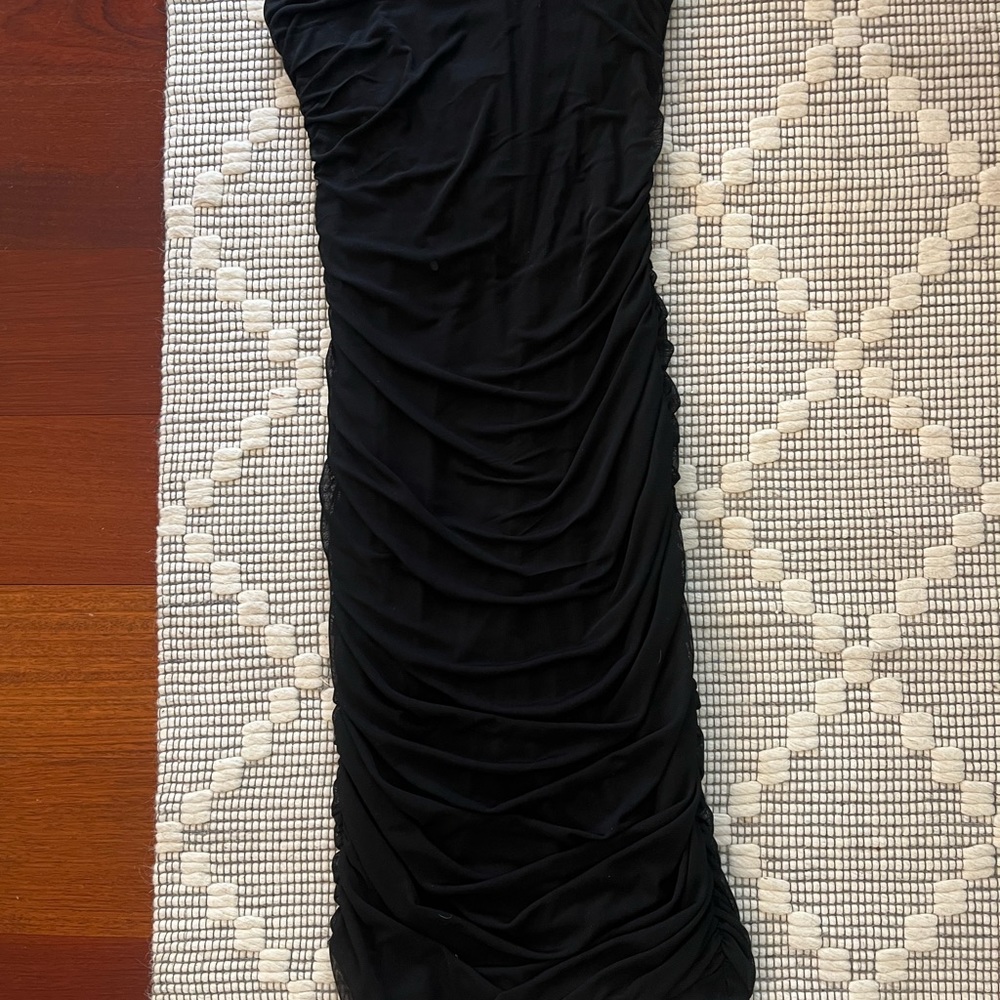 Size small stretchy Lycra black dress. Never worn